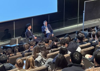 Blair Effron of Centerview Partners answers a question with a microphone while Siyang Ding listens, Weston Talks at Columbia University